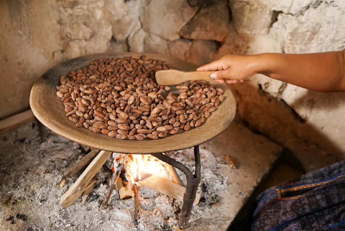 Open-flame clay hearths used to roast raw cacao beans over carefully tended fires